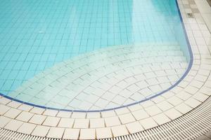 an empty swimming pool with poll stair photo