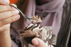 women eating Mousse cake close up photo