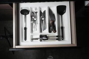 cutlery fork with knife and spoon in a drawer photo