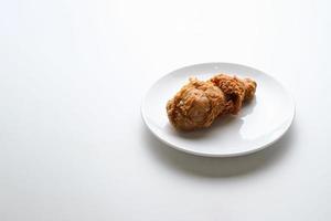 Top view fried chicken leg in white plate photo