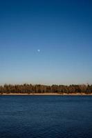 Dnipro river in Kyiv with the moon photo