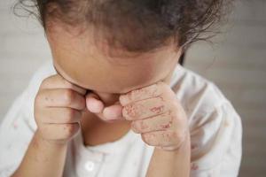 sad upset child girl crying looking down photo