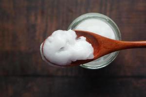 cold oil coconut on a wooden board photo