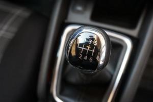 Gear stick of manual transmission of car with 6-speed and reverse position. photo