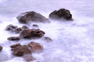 Beautiful seascape. Sea and rock at the sunset photo