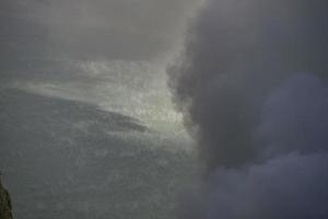 Sulfur mine with workers in Kawah Ijen, Java, Indonesia photo