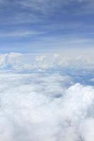 Airplane above clouds photo