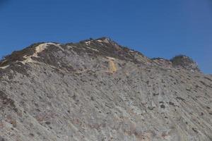 View from the tropical forest with path to the volcano Kawah Ijen, East Java, Indoneisa photo