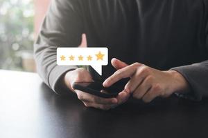 Satisfaction Survey Concept Reviews Customer Quality Assessment, Customer Rating on Smartphone, Service or Product Rating, 5 Star Rating. photo