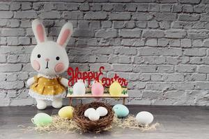 Easter rabbit with colorful eggs photo