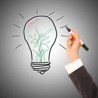 Businesswoman drawing and idea lamp photo