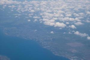 Bali island in tropical sea, veiw from airplane sight photo