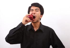 Healthy living. Man holding a red apple photo