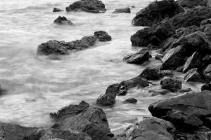 Beautiful seascape. Sea and rock at the sunset photo