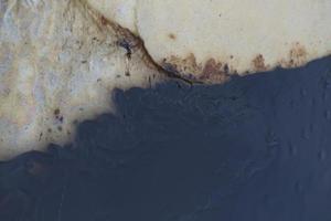 Gulf oil spill is shown on a beach photo