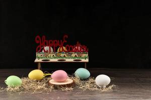 Easter rabbit with colorful eggs photo