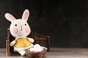 Easter rabbit with colorful eggs photo