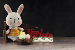 Easter rabbit with colorful eggs photo