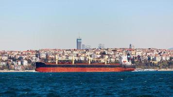 The tanker ship crosses the Bosporus on the background of Uskudar photo