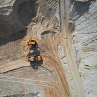 Aerial view of sand quarry with bulldozer photo