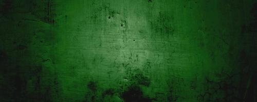 Green Wall Texture Background. Halloween background scary. green and Black grunge background with scratches photo