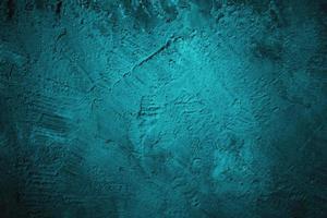 Abstract grunge blue stucco wall background. Dark stone wall concept background with space for text. photo