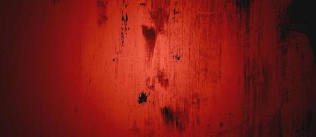 Dark red Wall Texture Background. Halloween background scary. Red and Black grunge background with scratches photo