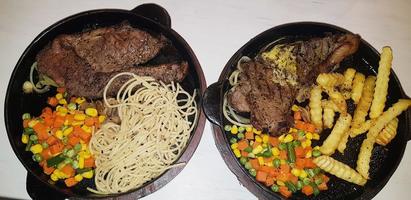 The best food in the world beef steak along with fried potatoes with delicious mushroom sauce and salad plated in beautiful black stripes plate photo