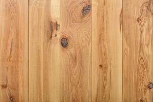 Vertical wooden planks with a pronounced texture of fibers and knots. photo