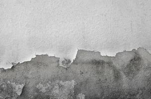 Grunge sucio muro de hormigón agrietado foto