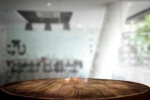 Selected focus empty brown wooden table and meeting room or office work blur background image. for your photomontage or product display photo