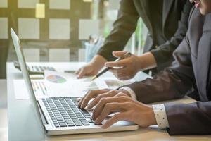 Team proces, Business adviser analyzing financial figures denoting the progress in the work of the company photo
