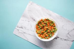 top view of corn, carrot and beans in a bowl, photo