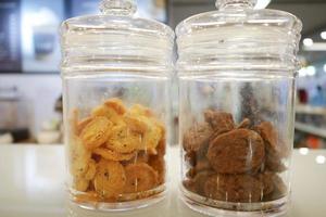 close up of sweet cookies in a glass jar photo