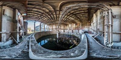 Full spherical seamless hdri panorama 360 degrees angle view concrete structures of abandoned ruined building of cement factory in equirectangular projection with zenith and nadir, VR AR content photo