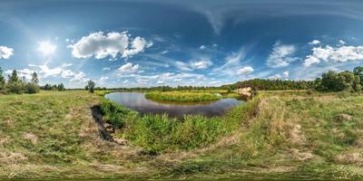 seamless spherical hdri panorama 360 degrees angle view on grass coast of huge lake or river in sunny summer day and windy weather with beautiful clouds in equirectangular projection, VR content photo