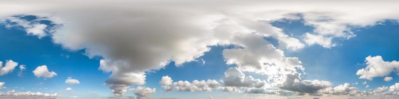 Seamless cloudy blue sky hdri panorama 360 degrees angle view with zenith and beautiful clouds for use in 3d graphics as sky dome or edit drone shot photo