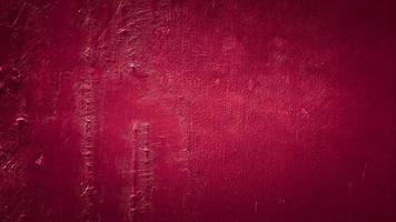 dark red grungy abstract cement concrete wall texture background photo