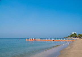 Floating piers along shore are place for tourists walk. Mooring boat plastic pontoon that floats in sea water. Blue sea view blue background look wave calm landscape viewpoint summer Nature tropical photo