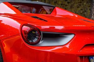 GERMANY, FULDA - JUL 2019 rearview lights of red FERRARI 488 SPIDER Type F142M coupe is a mid-engine sports car produced by the Italian automobile manufacturer Ferrari. The car is an update to the 458 photo