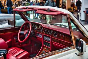 FRIEDRICHSHAFEN - MAY 2019 red interior in white ROLLS-ROYCE CORNICHE 1986 cabrio at Motorworld Classics Bodensee on May 11, 2019 in Friedrichshafen, Germany photo