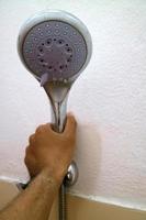 The end of the shower head is rounded for bathing photo