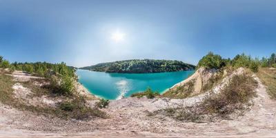 full seamless spherical hdri panorama 360 degrees angle view on chalkpit on limestone coast of huge turquoise lake in summer day in equirectangular projection with zenith and nadir, VR content photo