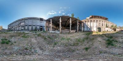 Full spherical seamless hdri panorama 360 degrees angle view concrete structures of abandoned ruined building of cement factory in equirectangular projection, VR AR content photo