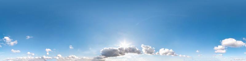 Seamless cloudy blue sky hdri panorama 360 degrees angle view with zenith and beautiful clouds for use in 3d graphics as sky dome or edit drone shot photo