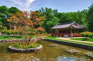 Korean Pagoda with small lake in the Park photo