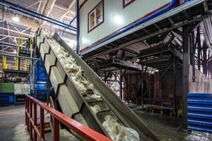 moving conveyor transporter on Modern waste recycling processing plant. Separate and sorting garbage collection. Recycling and storage of waste for further disposal. photo