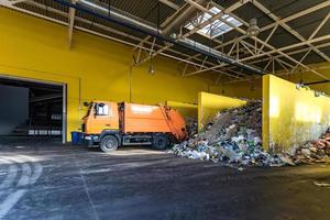 truck throws garbage at sorting modern waste recycling processing plant. Separate and sorting garbage collection. Recycling and storage of waste for further disposal. photo