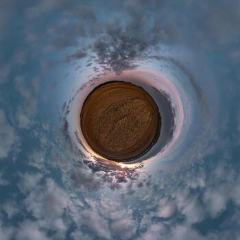 Little planet transformation of spherical panorama 360 degrees. Spherical abstract aerial view in field with awesome beautiful clouds. Curvature of space. photo