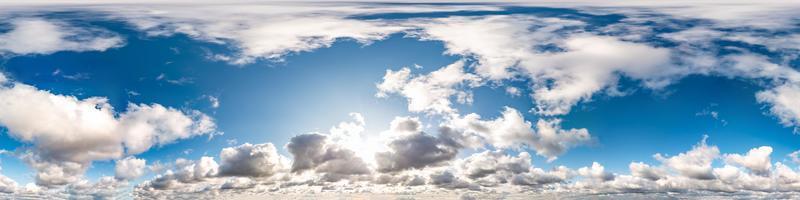 blue sky with beautiful cumulus clouds. Seamless hdri panorama 360 degrees angle view with zenith for use in 3d graphics or game development as sky dome or edit drone shot photo